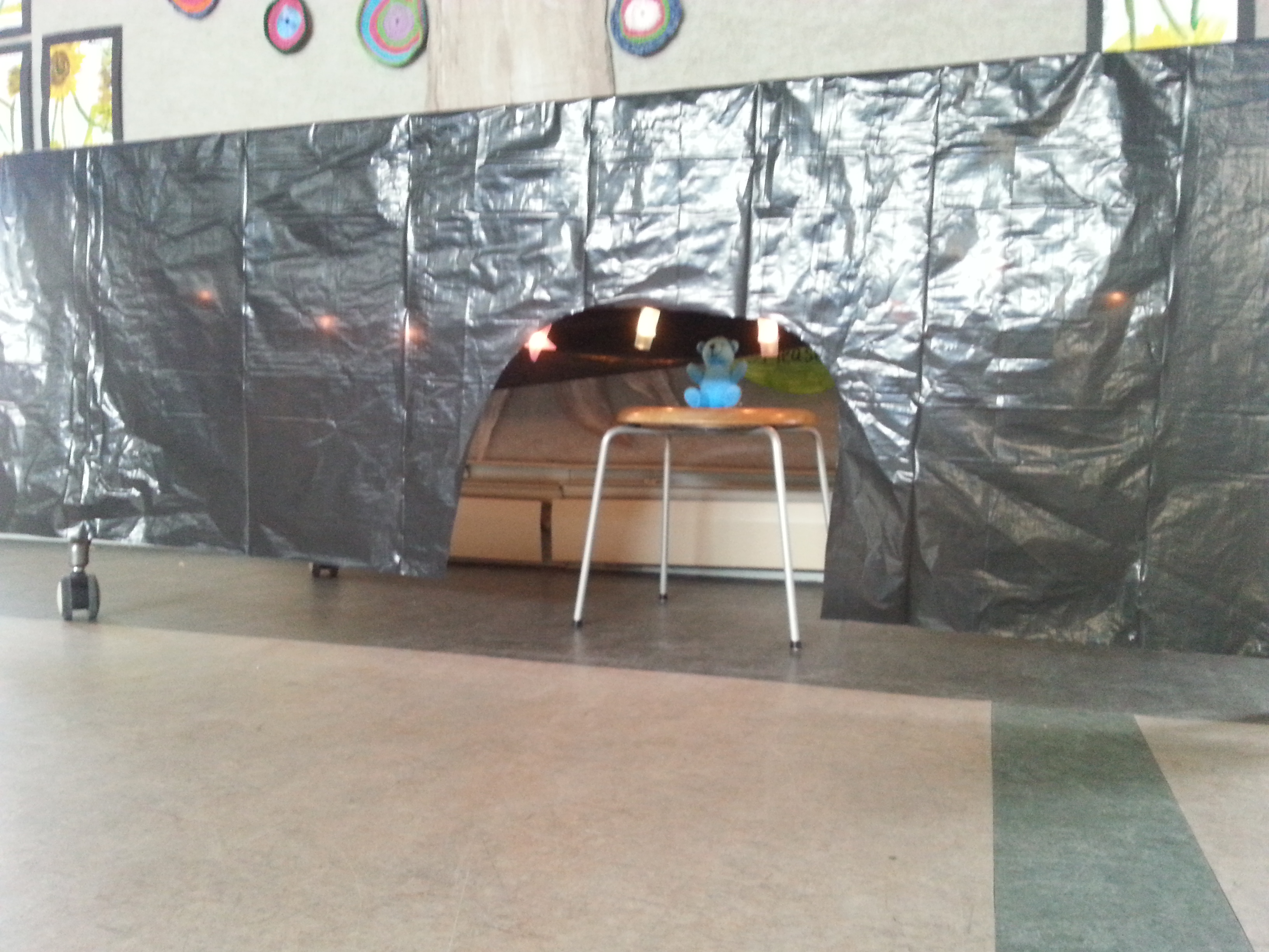 used two garbage bags and covered a table. I strung star lights 